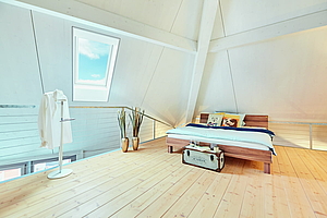 Aménager chambre mansardée avec une fenêtre de toit